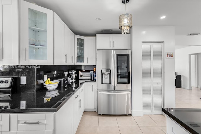 2340 SW 17th Ave, Miami, FL 33145 - kitchen featuring stainless steel fridge, light tile patterned floors, white cabinetry, glass insert cabinets, and recessed lighting