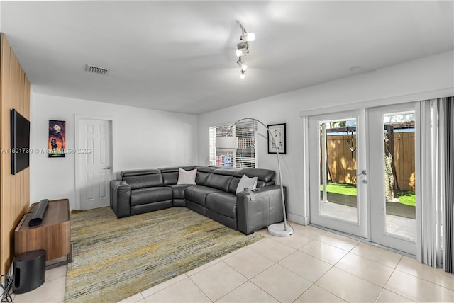 2340 SW 17th Ave, Miami, FL 33145 - living area featuring light tile patterned floors and rail lighting