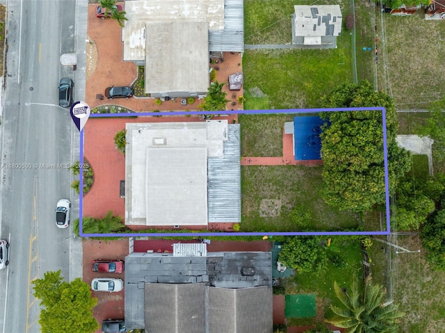 aerial view of property and surrounding area with property boundaries highlighted