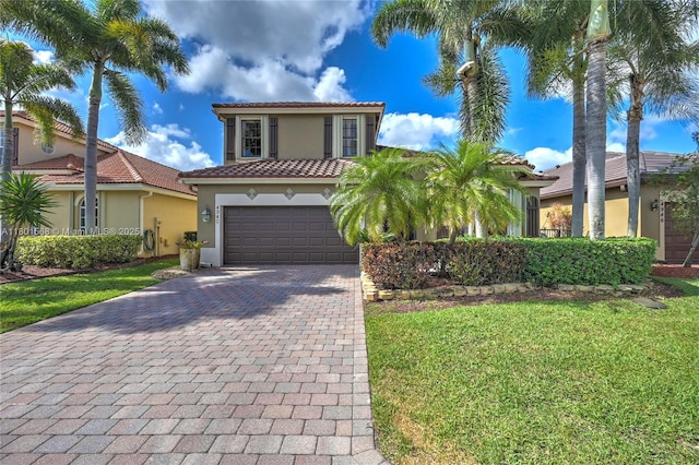 4940 Gateway Gardens Dr, Boynton Beach, FL 33436 - mediterranean / spanish house with stucco siding, decorative driveway, a tile roof, and a front yard