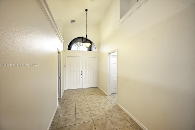 4940 Gateway Gardens Dr, Boynton Beach, FL 33436 - foyer entrance featuring light tile patterned floors and baseboards