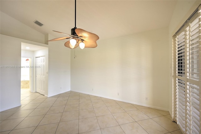 4940 Gateway Gardens Dr, Boynton Beach, FL 33436 - empty room with ceiling fan, vaulted ceiling, light tile patterned flooring, and baseboards