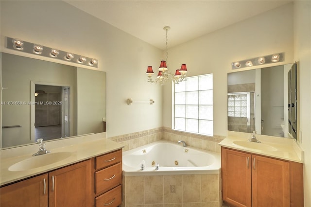 4940 Gateway Gardens Dr, Boynton Beach, FL 33436 - bathroom featuring a whirlpool tub, a chandelier, a shower stall, and two vanities