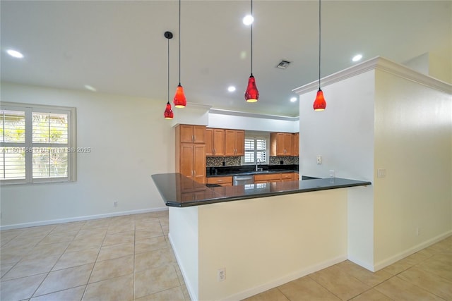 4940 Gateway Gardens Dr, Boynton Beach, FL 33436 - kitchen with dishwasher, dark countertops, recessed lighting, brown cabinets, and decorative backsplash