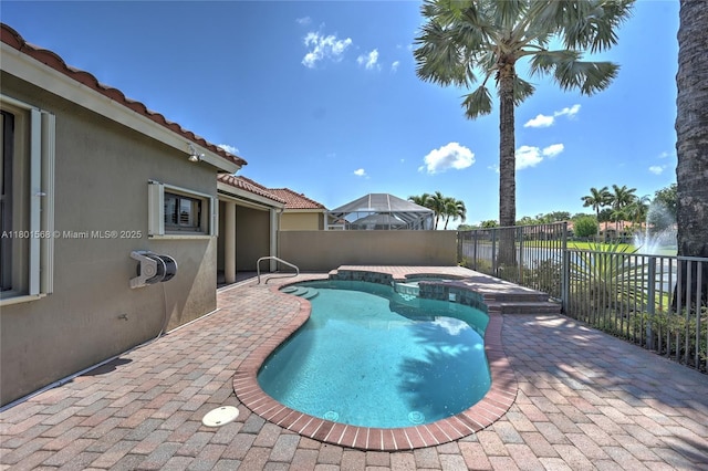 4940 Gateway Gardens Dr, Boynton Beach, FL 33436 - view of pool with a patio area, fence, and a pool with connected hot tub