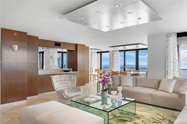 19667 Turnberry Way Unit 27-K, Aventura, FL 33180 - living area with a water view, recessed lighting, a raised ceiling, and expansive windows