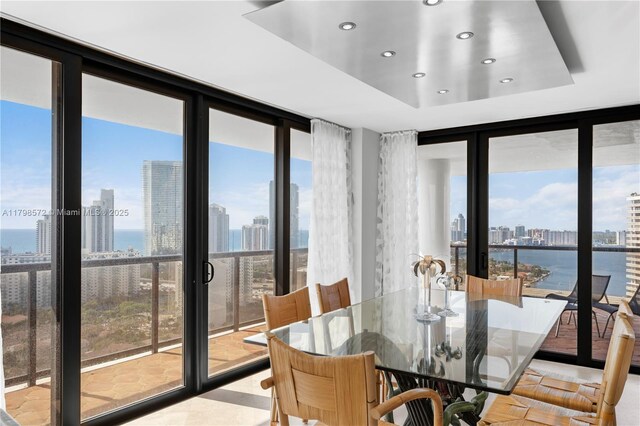 19667 Turnberry Way Unit 27-K, Aventura, FL 33180 - dining room featuring floor to ceiling windows, a skyline view, recessed lighting, and a water view