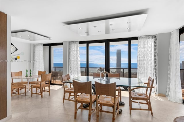 19667 Turnberry Way Unit 27-K, Aventura, FL 33180 - dining area featuring expansive windows, recessed lighting, a water view, healthy amount of natural light, and a raised ceiling