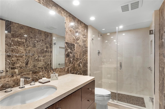 19667 Turnberry Way Unit 27-K, Aventura, FL 33180 - full bathroom featuring toilet, a stall shower, vanity, tile walls, and recessed lighting