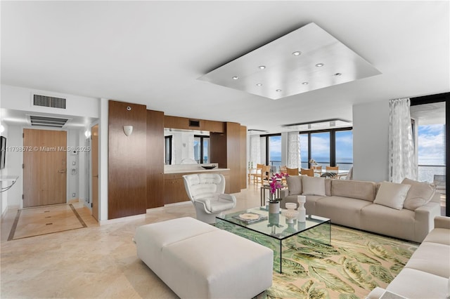 19667 Turnberry Way Unit 27-K, Aventura, FL 33180 - living area with a tray ceiling, healthy amount of natural light, and recessed lighting