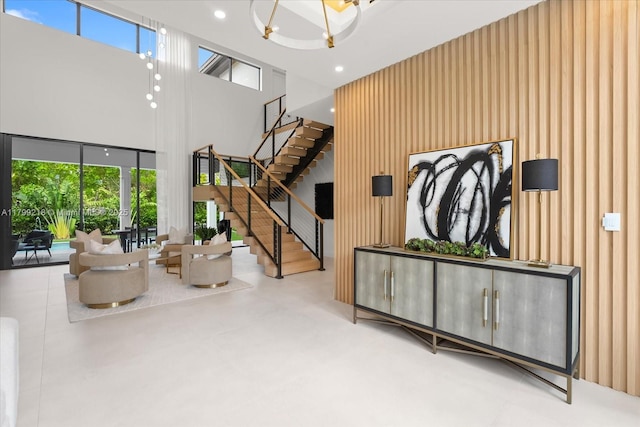 building lobby featuring a high ceiling, stairway, and recessed lighting