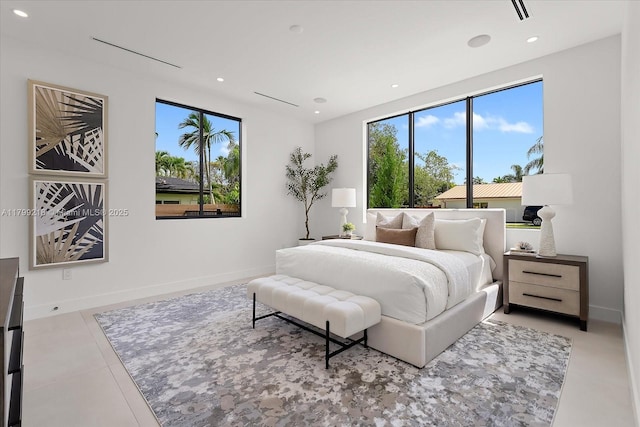 bedroom featuring multiple windows, tile patterned floors, recessed lighting, and baseboards