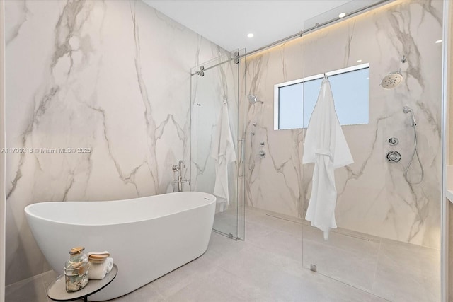 bathroom with a soaking tub and a marble finish shower