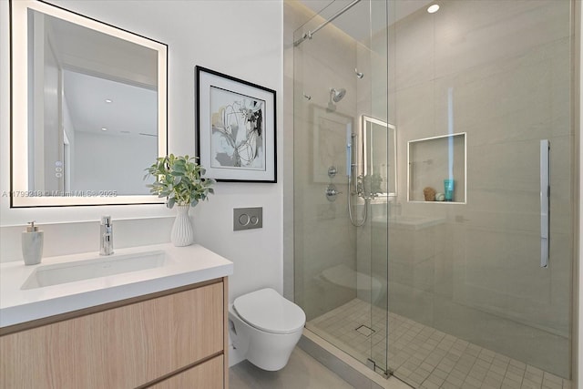 full bath with a shower stall, toilet, and vanity