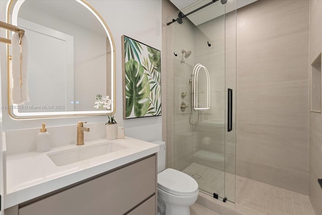 full bath with toilet, a stall shower, and vanity
