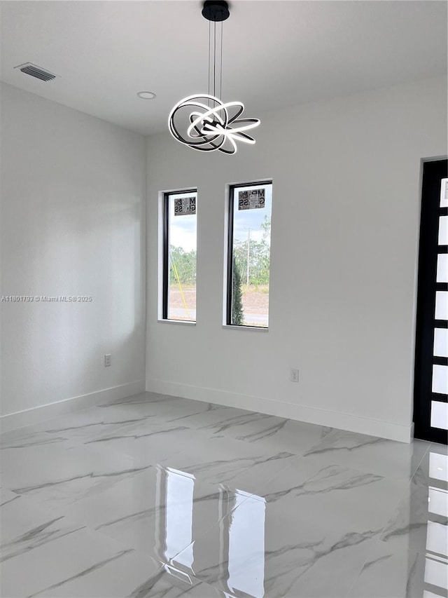 unfurnished dining area featuring baseboards, a chandelier, light marble finish floors, and recessed lighting
