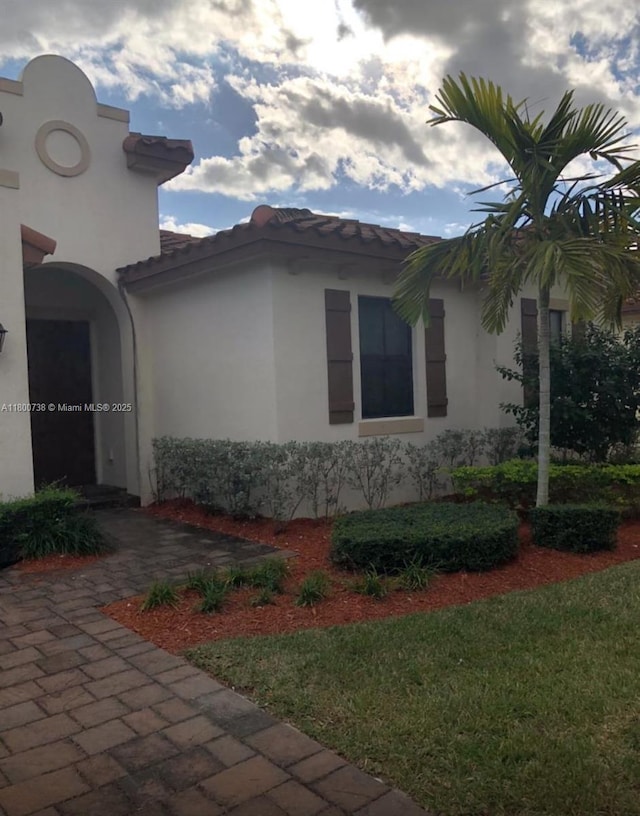 15400 SW 176th Ln, Miami, FL 33187 - view of home's exterior featuring a tiled roof and stucco siding