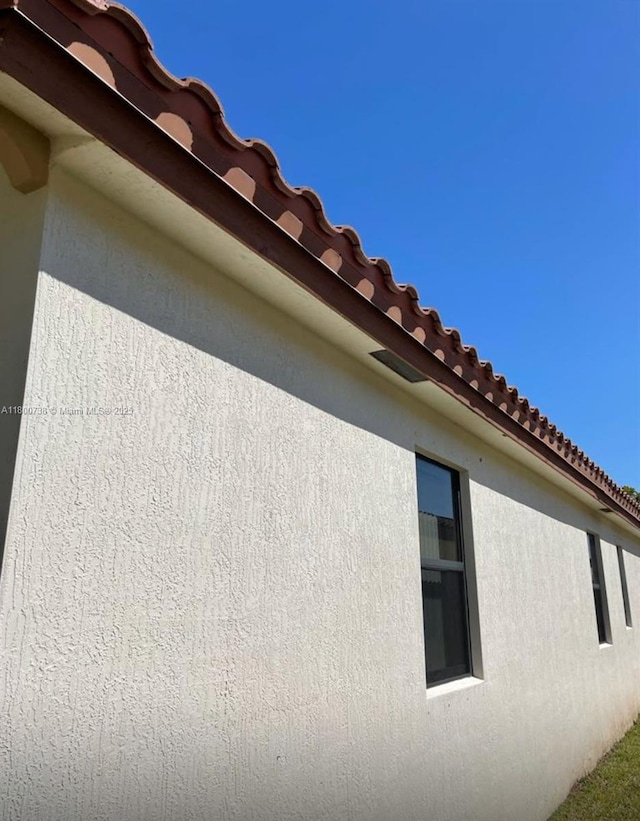 15400 SW 176th Ln, Miami, FL 33187 - view of side of property with stucco siding and a tile roof