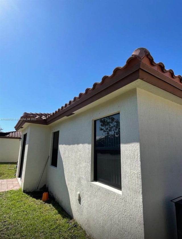 15400 SW 176th Ln, Miami, FL 33187 - view of property exterior featuring a tiled roof and stucco siding