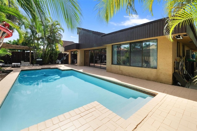 1032 NE 204th Ln Unit B, Miami, FL 33179 - view of swimming pool with a patio, fence, and a pergola
