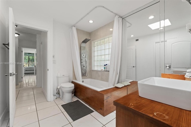 1032 NE 204th Ln Unit B, Miami, FL 33179 - ensuite bathroom with a sink, toilet, a skylight, shower / bath combo, and tile patterned floors