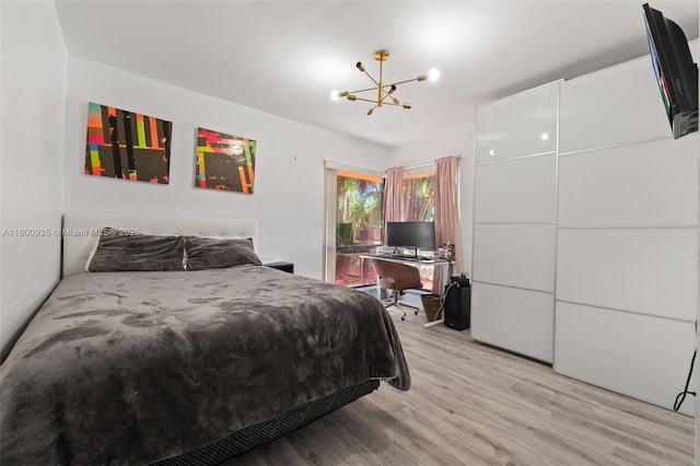 1032 NE 204th Ln Unit B, Miami, FL 33179 - bedroom featuring a chandelier and light wood-style flooring