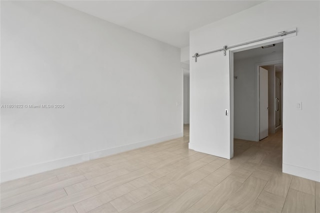 2000 Metropica Way Unit 2504, Sunrise, FL 33323 - spare room with baseboards and a barn door