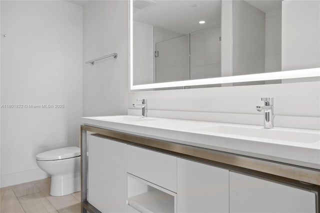 2000 Metropica Way Unit 2504, Sunrise, FL 33323 - full bathroom featuring toilet, a shower stall, double vanity, recessed lighting, and tile patterned floors