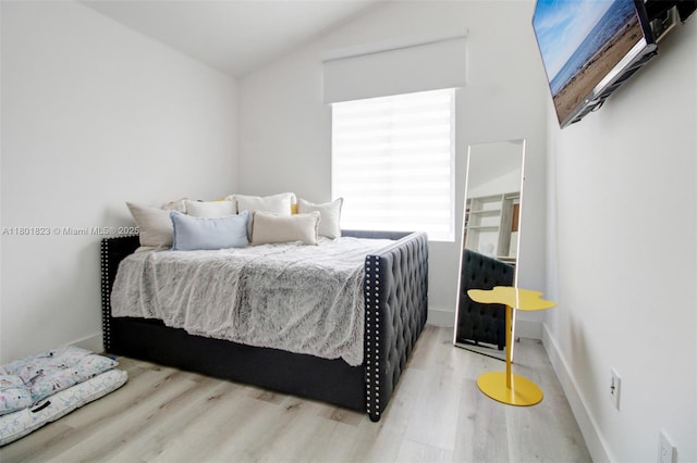 1187 NE 182nd St, North Miami Beach, FL 33162 - bedroom with wood finished floors, lofted ceiling, and baseboards