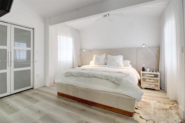 1187 NE 182nd St, North Miami Beach, FL 33162 - bedroom with wood finished floors, vaulted ceiling, and a ceiling fan