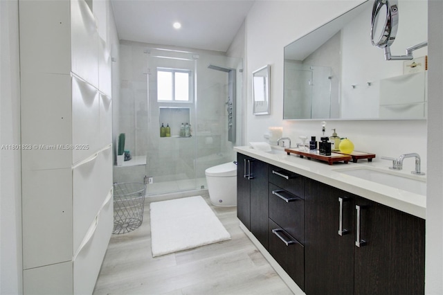 1187 NE 182nd St, North Miami Beach, FL 33162 - full bathroom featuring a shower stall, toilet, double vanity, recessed lighting, and wood finished floors