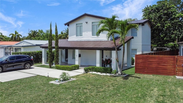 1187 NE 182nd St, North Miami Beach, FL 33162 - view of front of house with covered porch, stucco siding, metal roof, and concrete driveway
