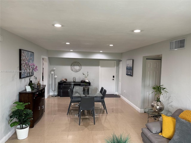 dining space with recessed lighting, baseboards, and light tile patterned floors