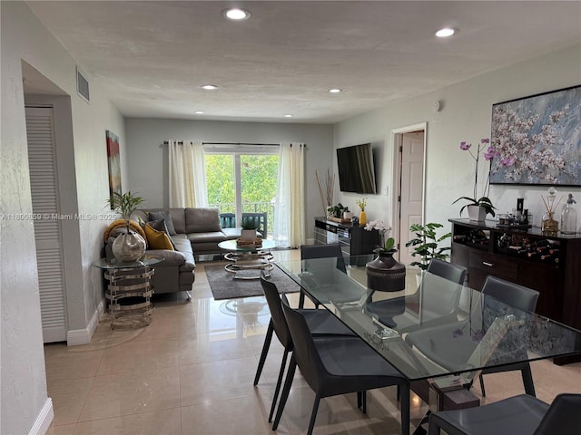 dining area featuring recessed lighting, baseboards, and light tile patterned flooring