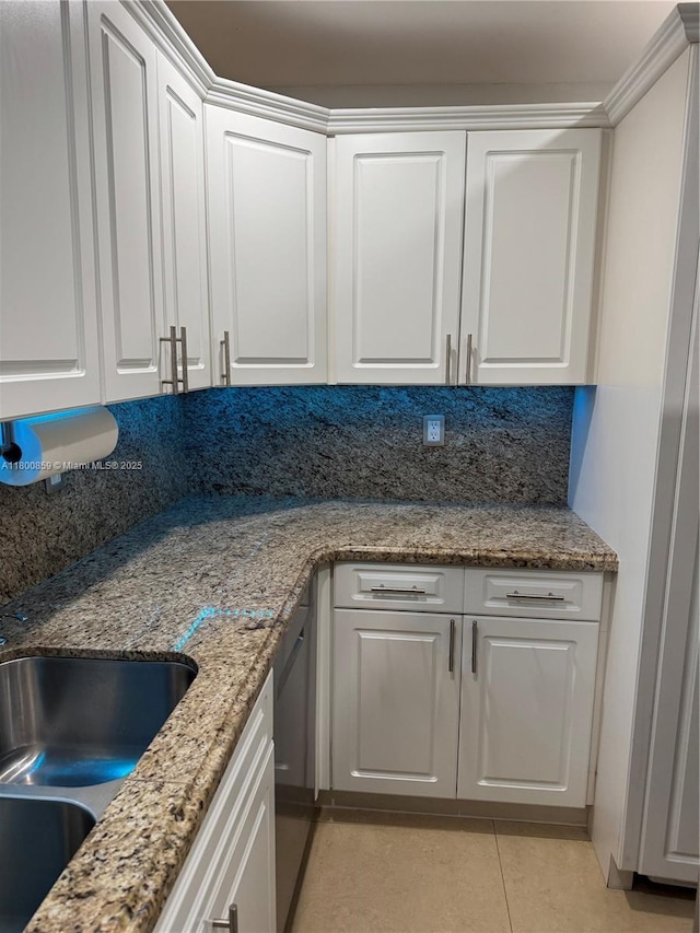bar with light tile patterned floors and stainless steel dishwasher