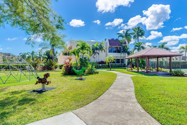 surrounding community with a gazebo and a yard