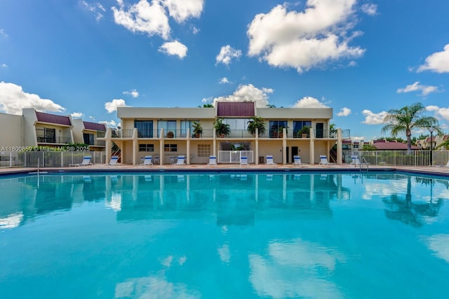 community pool featuring fence
