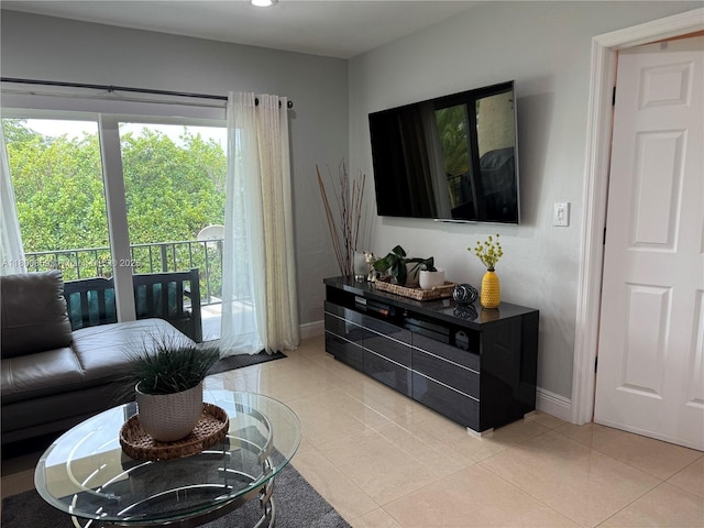living room featuring baseboards, light tile patterned flooring, and recessed lighting