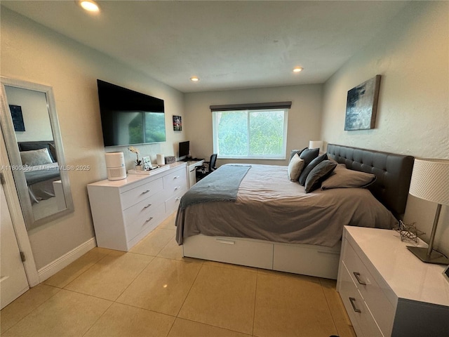 bedroom featuring light tile patterned floors and recessed lighting