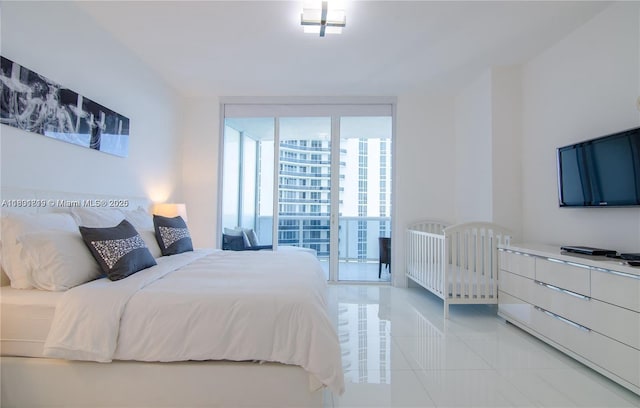 15811 Collins Ave Unit 2602, Sunny Isles Beach, FL 33160 - bedroom featuring tile patterned floors and expansive windows