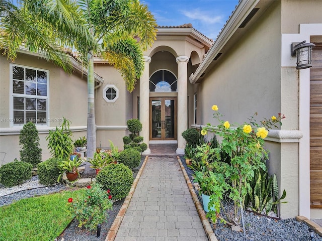 4985 NW 120th Ave, Coral Springs, FL 33076 - property entrance featuring french doors and stucco siding