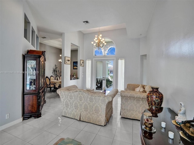4985 NW 120th Ave, Coral Springs, FL 33076 - living room featuring a chandelier, light tile patterned flooring, a towering ceiling, and baseboards