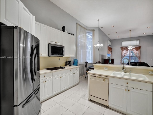 4985 NW 120th Ave, Coral Springs, FL 33076 - kitchen featuring stainless steel appliances, a sink, light countertops, light tile patterned flooring, and white cabinetry