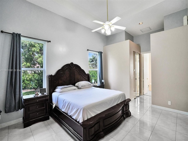 4985 NW 120th Ave, Coral Springs, FL 33076 - bedroom featuring baseboards, a ceiling fan, light tile patterned floors, and ensuite bath