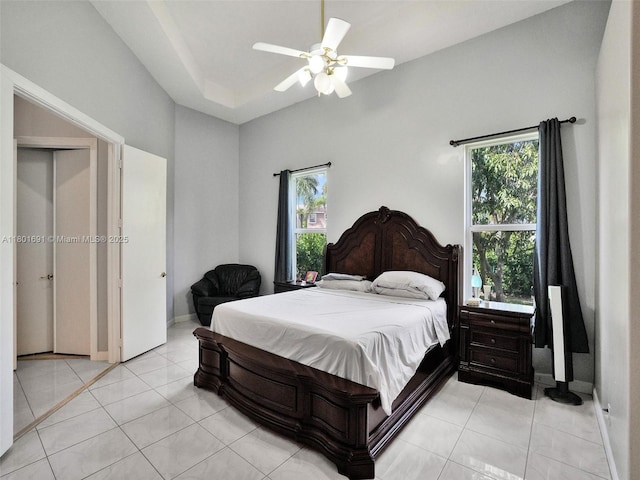 4985 NW 120th Ave, Coral Springs, FL 33076 - bedroom with multiple windows, light tile patterned floors, and ceiling fan