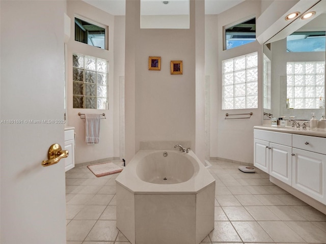 4985 NW 120th Ave, Coral Springs, FL 33076 - full bathroom featuring tile patterned floors, a bath, healthy amount of natural light, and a high ceiling