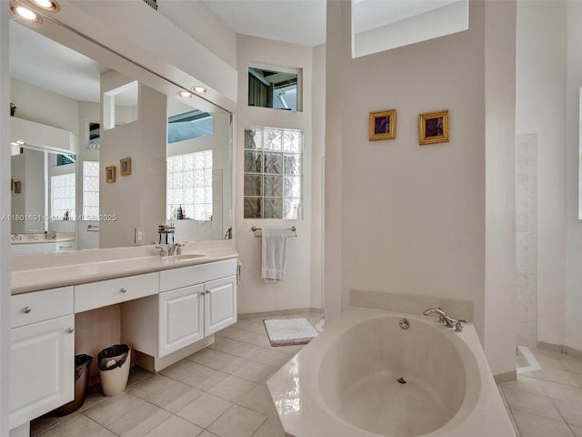 4985 NW 120th Ave, Coral Springs, FL 33076 - full bathroom featuring a bath, tile patterned floors, and vanity