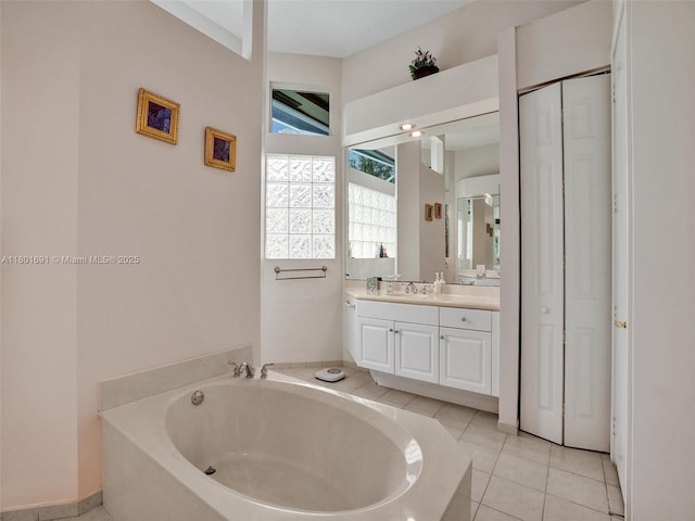 4985 NW 120th Ave, Coral Springs, FL 33076 - bathroom with a garden tub, vanity, and tile patterned floors
