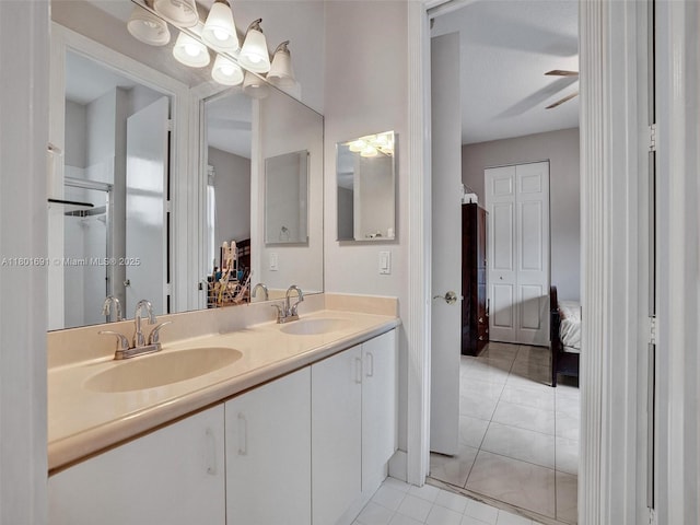 4985 NW 120th Ave, Coral Springs, FL 33076 - ensuite bathroom featuring double vanity, tile patterned floors, and a chandelier