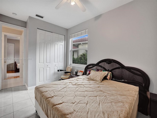 4985 NW 120th Ave, Coral Springs, FL 33076 - tiled bedroom featuring a closet, a ceiling fan, and baseboards
